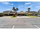 Charming exterior featuring a covered parking area and lush landscaping at 644 Yardarm Dr # 22, Apollo Beach, FL 33572