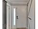 Traditional white front door with glass insert and a modern smart lock at 644 Yardarm Dr # 22, Apollo Beach, FL 33572