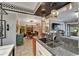 Open concept kitchen with granite countertops and view into the dining area at 644 Yardarm Dr # 22, Apollo Beach, FL 33572