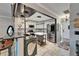 Open kitchen featuring stainless steel appliances, granite countertops, a bar, and white cabinets at 644 Yardarm Dr # 22, Apollo Beach, FL 33572