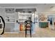 Open concept view between living and kitchen, featuring an eclectic art collection at 644 Yardarm Dr # 22, Apollo Beach, FL 33572