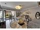 Bright living room featuring a sectional sofa, outdoor access, and stylish decor at 644 Yardarm Dr # 22, Apollo Beach, FL 33572