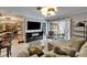 Open living room with a sectional sofa, outdoor access, and unique furniture pieces at 644 Yardarm Dr # 22, Apollo Beach, FL 33572