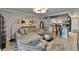 Stylish living room with a comfortable sectional sofa, unique coffee table, and bar area at 644 Yardarm Dr # 22, Apollo Beach, FL 33572