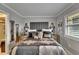 Comfortable main bedroom showcasing stylish decor, sconces, and serene ambiance at 644 Yardarm Dr # 22, Apollo Beach, FL 33572