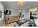 Bright main bedroom with a TV, dresser, and access to the bathroom and living area at 644 Yardarm Dr # 22, Apollo Beach, FL 33572