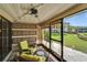 Relaxing sunroom features comfortable seating and a beautiful outdoor view at 644 Yardarm Dr # 22, Apollo Beach, FL 33572