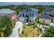 Aerial view of the home with tropical landscaping at 6520 Simone Shores Cir, Apollo Beach, FL 33572