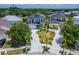 Aerial view of the homes with tropical landscaping and a paver driveway at 6520 Simone Shores Cir, Apollo Beach, FL 33572