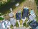 Aerial view of the property line on a home with an in-ground pool and boat dock on the water at 6520 Simone Shores Cir, Apollo Beach, FL 33572