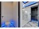 Contemporary bathroom featuring a toilet and glass shower enclosure with ambient lighting and marble accents at 6520 Simone Shores Cir, Apollo Beach, FL 33572