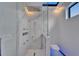 Modern bathroom features a glass enclosed shower with marble walls and a sleek toilet at 6520 Simone Shores Cir, Apollo Beach, FL 33572