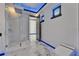 Sleek bathroom featuring a glass shower, contemporary fixtures, and marble tile flooring at 6520 Simone Shores Cir, Apollo Beach, FL 33572