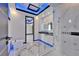 Modern bathroom featuring a glass shower enclosure, toilet, and doorway with stylish ambient lighting at 6520 Simone Shores Cir, Apollo Beach, FL 33572