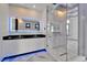 Modern bathroom with a glass shower enclosure, granite counters, and an LED illuminated mirror at 6520 Simone Shores Cir, Apollo Beach, FL 33572