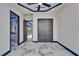 Spacious bedroom featuring marble floors, ambient ceiling lighting, and doorways leading to additional rooms at 6520 Simone Shores Cir, Apollo Beach, FL 33572