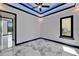 Bright bedroom featuring marble floors, a modern ceiling with accent lighting, and a mini-split air conditioner at 6520 Simone Shores Cir, Apollo Beach, FL 33572