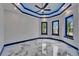 Expansive bedroom with modern ceiling fan, ambient perimeter lighting, and large windows offering plenty of natural light at 6520 Simone Shores Cir, Apollo Beach, FL 33572