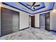 Bright bedroom featuring marble floors, ambient ceiling lighting, closet, and doorways to the bathroom and hallway at 6520 Simone Shores Cir, Apollo Beach, FL 33572