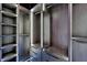 Custom walk-in closet with adjustable shelves, drawers, and built-in lighting for organization at 6520 Simone Shores Cir, Apollo Beach, FL 33572
