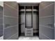 Walk-in closet with custom built-in shelving, drawers, and hanging rods for optimal organization at 6520 Simone Shores Cir, Apollo Beach, FL 33572