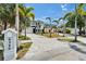 Beautiful home with lush palm trees, a large driveway, and a manicured lawn creating a welcoming curb appeal at 6520 Simone Shores Cir, Apollo Beach, FL 33572