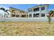 Exterior shot of modern home next to a sand lot at 6520 Simone Shores Cir, Apollo Beach, FL 33572