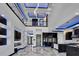 Stunning foyer with marble floors, modern lighting, and open sight lines to the kitchen and great room at 6520 Simone Shores Cir, Apollo Beach, FL 33572