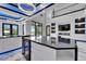 Modern kitchen with island, stainless steel appliances, and stylish lighting fixtures at 6520 Simone Shores Cir, Apollo Beach, FL 33572