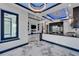 Open-concept living area with sleek finishes, marble flooring, and modern accents at 6520 Simone Shores Cir, Apollo Beach, FL 33572