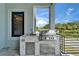 Outdoor kitchen featuring modern grill, sink, and storage; ideal for entertaining at 6520 Simone Shores Cir, Apollo Beach, FL 33572