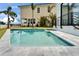 Beautiful inground pool featuring stone trim and mosaic tile at 6520 Simone Shores Cir, Apollo Beach, FL 33572