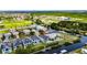 Aerial view of waterfront community featuring lush landscaping, private pools, and canal access at 6526 Simone Shores Cir, Apollo Beach, FL 33572