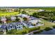 Aerial view of a waterfront home with lush landscaping, private pool, and convenient canal access at 6526 Simone Shores Cir, Apollo Beach, FL 33572