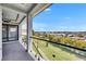 Enjoy the view from the balcony, featuring glass railings that open up to a serene landscape at 6526 Simone Shores Cir, Apollo Beach, FL 33572