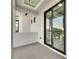 Outdoor balcony with sliding glass doors and tiled flooring, overlooking the neighborhood and greenery at 6526 Simone Shores Cir, Apollo Beach, FL 33572