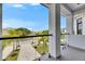 Balcony view showcasing the neighborhood with palm trees, landscaped lawns, and beautiful blue skies at 6526 Simone Shores Cir, Apollo Beach, FL 33572