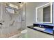Modern bathroom featuring a glass shower, stylish vanity, and unique lighting at 6526 Simone Shores Cir, Apollo Beach, FL 33572