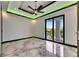 Spacious bedroom boasting marble floors, recessed lighting, ceiling fan, and a private balcony with sliding glass doors at 6526 Simone Shores Cir, Apollo Beach, FL 33572
