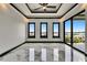 Bright bedroom with large windows, sliding glass doors, and marble flooring at 6526 Simone Shores Cir, Apollo Beach, FL 33572