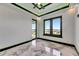 Bright bedroom features large windows, stylish marble floors, and elegant black trim at 6526 Simone Shores Cir, Apollo Beach, FL 33572