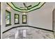 Bright bedroom with large windows, modern lighting, and stylish marble flooring at 6526 Simone Shores Cir, Apollo Beach, FL 33572