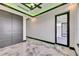 Modern bedroom showcasing marble floors, stylish trim, and ample closet space at 6526 Simone Shores Cir, Apollo Beach, FL 33572
