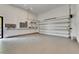 Spacious garage with epoxy flooring and electrical panel at 6526 Simone Shores Cir, Apollo Beach, FL 33572