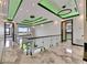 Bright hallway with glass railings, marble floors, and stylish modern lighting at 6526 Simone Shores Cir, Apollo Beach, FL 33572