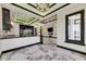 Open kitchen boasts high-end appliances, sleek cabinetry, and an expansive island perfect for entertaining at 6526 Simone Shores Cir, Apollo Beach, FL 33572