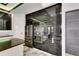 Kitchen boasts stainless steel appliances, sleek black cabinetry, and a center island at 6526 Simone Shores Cir, Apollo Beach, FL 33572