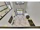 This open-concept area showcases a modern living space with kitchen and sleek marble flooring at 6526 Simone Shores Cir, Apollo Beach, FL 33572