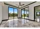 Bright living room with large windows offering expansive views of the outdoors at 6526 Simone Shores Cir, Apollo Beach, FL 33572