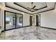 Open floor plan features marble floors and sliding doors to patio at 6526 Simone Shores Cir, Apollo Beach, FL 33572